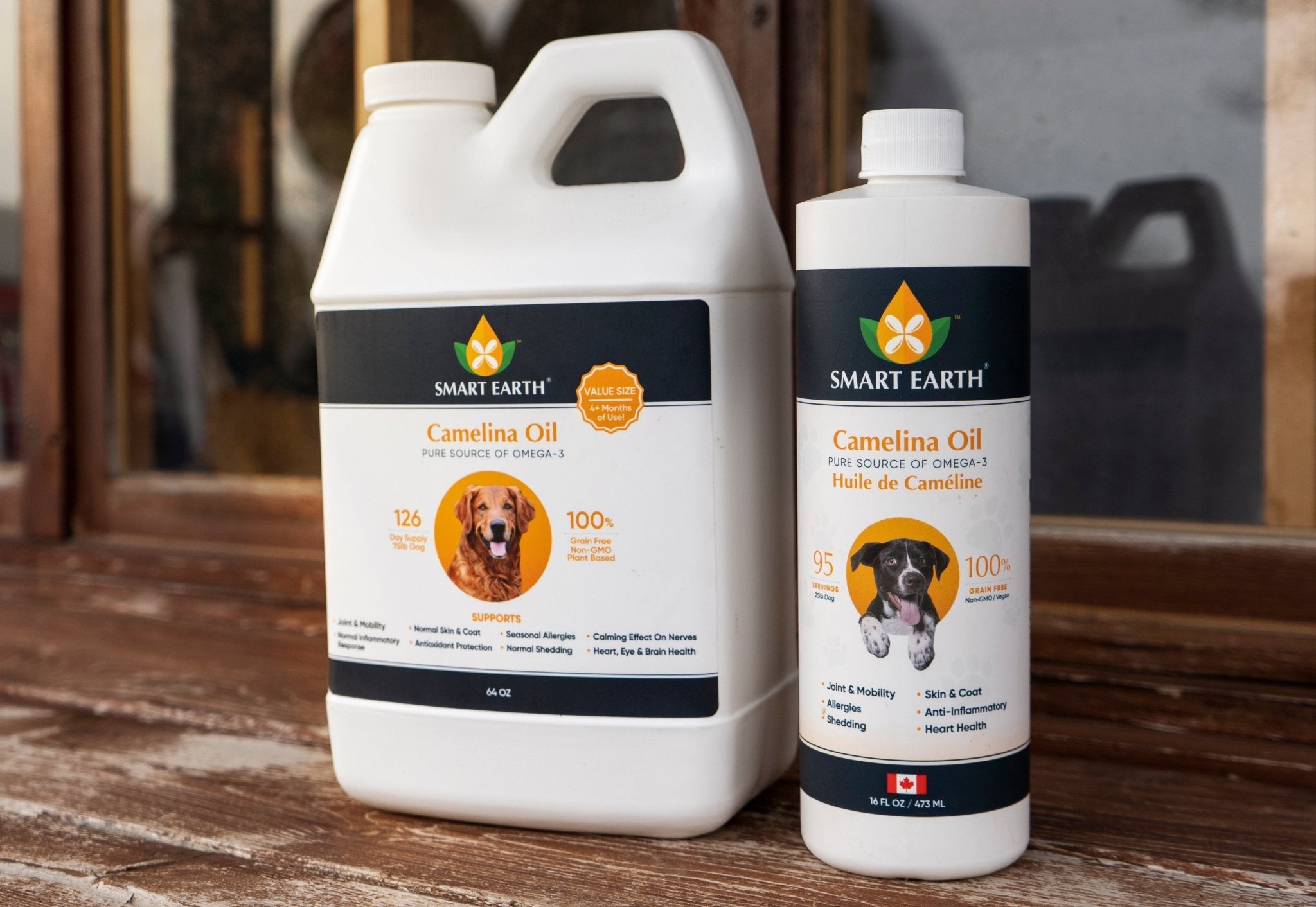 Smart Earth Premium Camelina Oil for Dogs & Cats shown in 1L and 473ml bottles on a wooden surface.